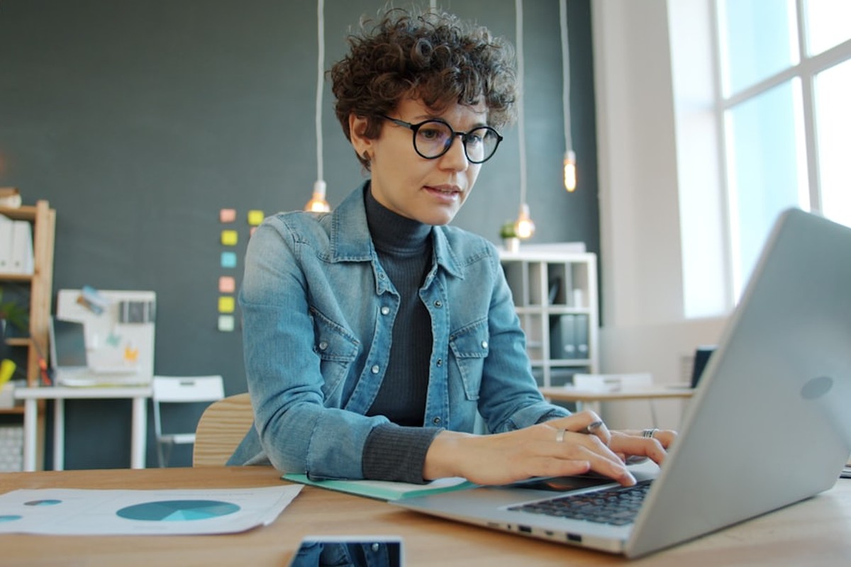 people sitting on chair in front of computer monitor