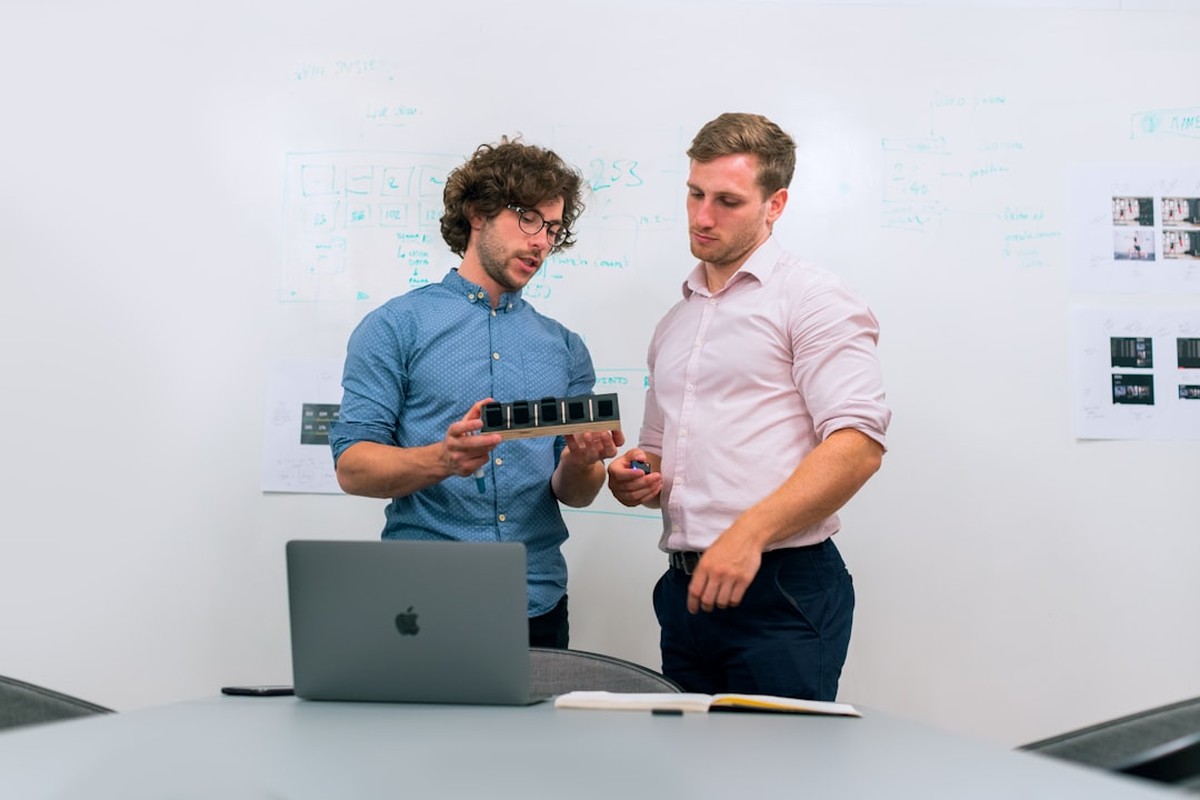 people sitting on chair in front of computer monitor