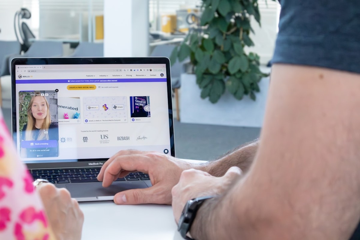 people sitting on chair in front of computer monitor